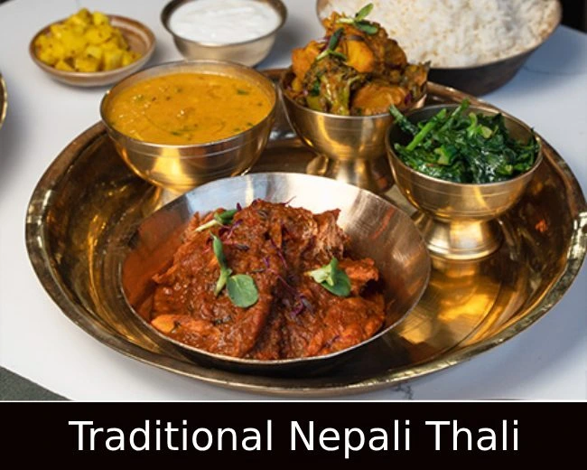 Nepalese thali platter with rice, lentils, and curries at Aama Nepalese Cuisine